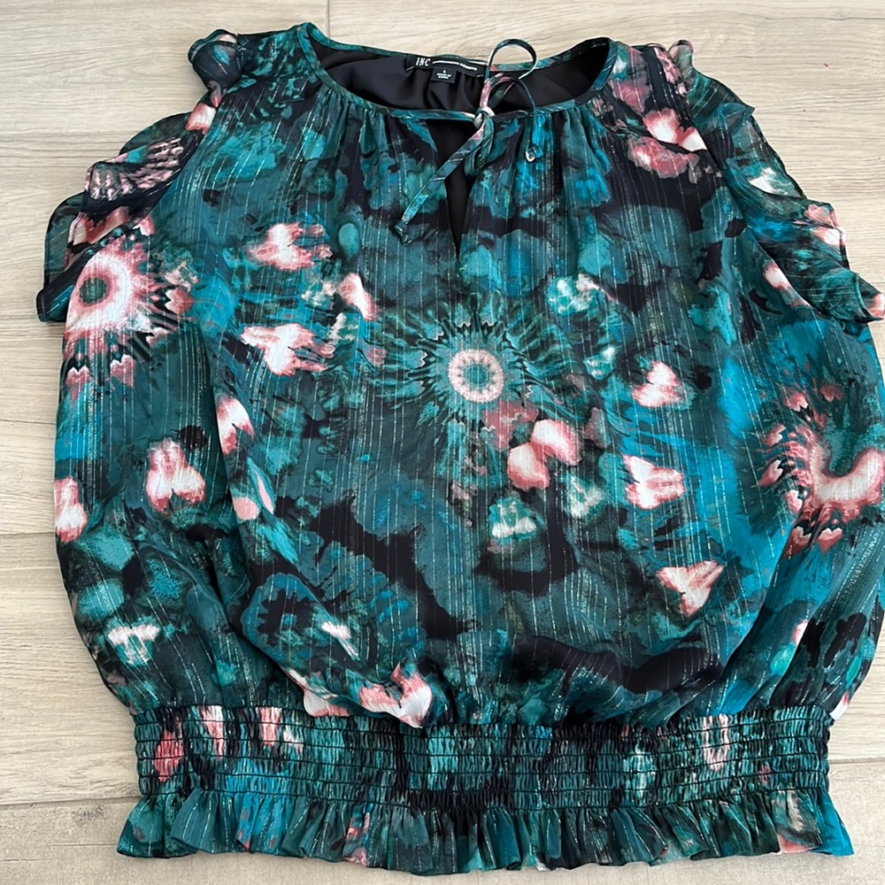 INC blouse with ruffle arm.